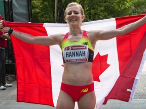 Rachel Hannah celebrates after being the first woman to cross the finish line at the Ottawa Marathon on May 24. She will be among the compeitors at the Canadian cross-country championships at Fort Henry on Saturday.
(Errol McGihon/Postmedia Network)