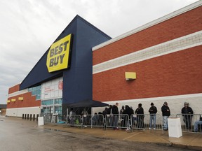Shoppers wait for the opening of the Best Buy store in Benton Harbor, Mich., Thursday, Nov. 26, 2015. (Don Campbell/The Herald-Palladium via AP)