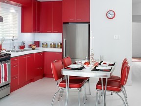 ?Lipstick red? cabinet doors give this kitchen enough va va voom to send the Happy Days diner into a milk shake meltdown. INSET: C&J can?t understand why such a large home had such a small kitchen.