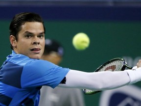 Milos Raonic returns a shot to Rafael Nadal during their match at the Shanghai Masters in Shanghai, China, October 15, 2015. (REUTERS/Aly Song)