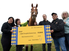 Pender Harbour’s owners, Denny Andrews, Sandra Lazaruk and Robert and Roberta Giffin, donated $15,000 in the horse’s name to the LongRun Thoroughbred Retirement Society on Thursday. (MICHAEL BURNS/PHOTO)