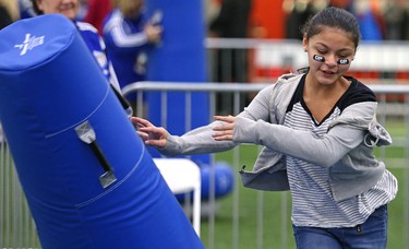 A young girl pushes an obstacle aside during the MacDon Fan Experience and Family Zone at the Axworthy Health & Recplex on the University of Winnipeg campus on Thu., Nov. 26, 2015. Kevin King/Winnipeg Sun/Postmedia Network