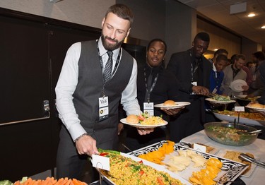 Edmonton Eskimos quarterback Mike Reilly fills his plate up during the team lunch in Winnipeg, Man., on Thursday, November 26, 2015 before the up coming 103rd CFL Grey Cup game against the Ottawa Redblacks. THE CANADIAN PRESS/Nathan Denette