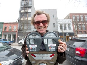 Lincoln McCardle is heading an initiative to turn old parking meters into receptacles to collect charitable donations for the homeless in London. (DEREK RUTTAN, The London Free Press)