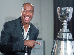 Ottawa Redblacks quarterback Henry Burris looks at the Grey Cup during the team breakfast before the up coming CFL 103rd CFL Grey Cup game against the Edmonton Eskimos in Winnipeg, Man., on Thursday, November 26, 2015. (THE CANADIAN PRESS/Nathan Denette)