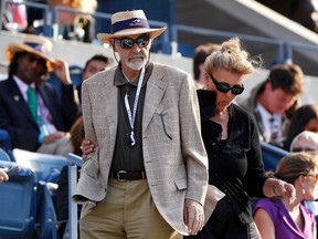 Actor Sean Connery and his wife Micheline Roquebrune arrive for the U.S. Open men's final match between Serbia's Novak Djokovic and Britain's Andy Murray in New York, September 10, 2012. REUTERS/Adam Hunger