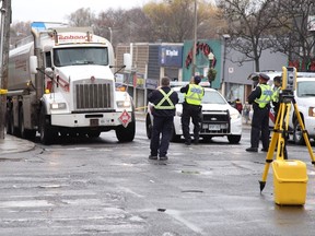 The truck involved in a fatal accident in Forest Hill on Friday, Nov. 27, 2015, is repositioned at the scene of impact for reconstruction purposes. (ERNEST DOROSZUK/Toronto Sun)