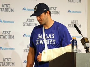 Dallas Cowboys quarterback Tony Romo turns away from the podium at a news conference after the Cowboys’ 33-14 loss to the Carolina Panthers Thursday, Nov. 26, 2015, in Arlington, Tex. (AP Photo/Brandon Wade)