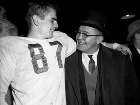 1956 Grey Cup. Quarterback Don Getty celebrates, with an unidentified person in the dressing room after winning the 44th Grey Cup by beating the Montreal Alouettes 50–27 on Nov. 24, 1956, in front of 27,425 fans at Varsity Stadium in Toronto, Ont. Getty played for the Eskimos for ten years and is still one of the most successful Canadian-born quarterbacks in the history of the Canadian Football League (CFL) by throwing nearly nine thousand yards in his career. City of Toronto Archives