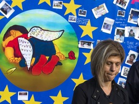 Canadian Tima Kurdi, the aunt of of three-year-old Syrian refugee Alan Kurdi who died trying to reach Greece from Turkey, reacts in front of a painting depicting the drowned Syrian child during a demonstration in Brussels on September 14, 2015. Kurdi says Citizenship and Immigration Canada has approved her application to bring her brother Mohammed and his family to Canada. REUTERS/Yves Herman