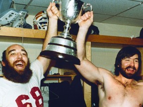 1982 Grey Cup. The Edmonton Eskimos Hector Pothier (left) and Leo Blanchard celebrate in the dressing room after winning the 70th Grey Cup game (nicknamed the “Rain Bowl”) on Nov. 28, 1982, at Exhibition Stadium in Toronto, Ont. The Eskimos beat the Toronto Argonauts 32 -16. The Eskimos won the Canadian Football League championship five years in a row, 1978, 1979, 1980, 1981 and 1982. Photo Courtesy/Canadian Football Hall of Fame