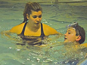 Alison Munro helps Cohen during the Children's Treatment Centre's sensory swimming class. The pool is specially designed for children with all kinds of physical limitations and developmental delays. LOUIS PIN/ CHATHAM THIS WEEK/ POSTMEDIA NETWORK