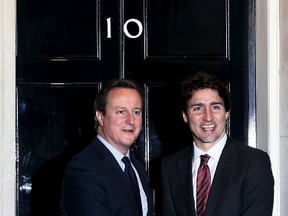 Britain's Prime Minister David Cameron (L) meets his Canadian counterpart Justin Trudeau outside of 10 Downing Street in London, Britain, November 25, 2015. REUTERS/Stefan Wermuth