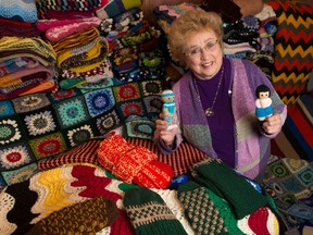 Eileen McCaughey with some of the knitting she has amassed that are donated to various needy people. Friday November 27, 2015. Errol McGihon/Ottawa Sun/Postmedia Network