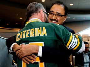 Councillor Tony Caterina greets new Federal Infrastructure and Communities Minister Amarjeet Sohi prior to an Edmonton City Council meeting at City Hall, in Edmonton, Alta. on Friday Nov. 27, 2015. David Bloom/Edmonton Sun