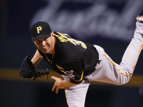 Pittsburgh Pirates starting pitcher J.A. Happ throws during the first inning of a baseball game Tuesday, Sept. 22, 2015. The Toronto Blue Jays have added more depth to their starting rotation, signing left-hander Happ on Friday to a three-year contract worth US$36 million. (THE CANADIAN PRESS/AP, David Zalubowski)
