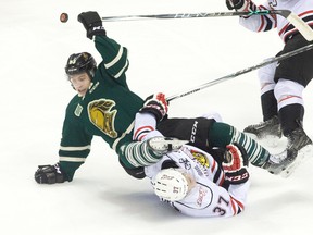 London Knights forward Mitch Marner collides with Owen Sound Attack forward Nick Suzuki during their OHL hockey game at Budweiser Gardens in London, Ont. on Friday November 27, 2015. (CRAIG GLOVER, The London Free Press)
