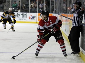 Ottawa 67's captain Travis Konecny searches for the pass against the Kingston Frontenacs in the first period of Ontario Hockey League action at the Rogers K-Rock Centre in Kingston, Ont. on Wednesday November 25, 2015. Steph Crosier/Kingston Whig-Standard/Postmedia Network