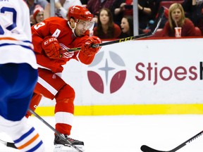 Nov 27, 2015; Detroit, MI, USA; Detroit Red Wings center Pavel Datsyuk (13) takes a shot in the third period against the Edmonton Oilers at Joe Louis Arena. Detroit won 4-3 in overtime. Mandatory Credit: Rick Osentoski-USA TODAY Sports