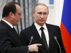 Russia's President Vladimir Putin (R) and his French counterpart Francois Hollande speak after a news conference at the Kremlin in Moscow, Russia, November 26, 2015. REUTERS/Alexander Zemlianichenko/Pool