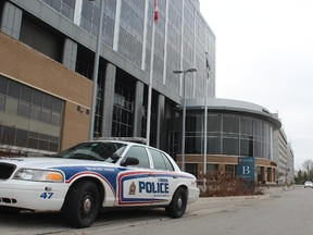 A police cruiser is parked outside of Victoria Hospital?s B entrance, where a critically injured stabbing victim was dumped on the weekend. (DALE CARRUTHERS, The London Free Press)