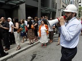 Thousands of people were evacuated from downtown office buildings after an earthquake hit the city just before 2 p.m. Wednesday, June 23, 2010. Jade Sambrook, an office fire warden on his floor at 131 Queen St. directs employees to return to their desks, grab their belongings and go home. 
Ottawa Sun file photo.