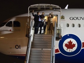 Prime Minister Justin Trudeau, Sophie Gregoire-Trudeau and their children Ella-Grace Trudeau and Hadrien Trudeau wave as they disembark the government plane at the airport in Orly, France. Trudeau is in Paris to attend the UN climate change summit. (THE CANADIAN PRESS/Adrian Wyld)