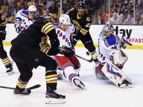 Rangers goalie Henrik Lundqvist can't stop the shot from Bruins forward Ryan Spooner (left) during third period action in Boston on Friday, Nov. 27, 2015. (Maddie Meyer/Getty Images/AFP)