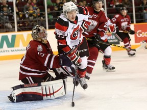 Ottawa 67's forward Artur Tyanulin gets in the way of Guelph Storm goalie Michael Giugovaz during the first period of the game at TD Place on Saturday, Nov. 28, 2015. (Chris Hofley/Ottawa Sun)