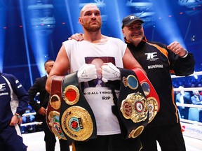 Boxer Tyson Fury celebrates after defeating Wladimir Klitschko for the WBA, IBF and WBO heavyweight title's at Esprit Arena in Dusseldorf, Germany on Saturday, November 28, 2015. (Reuters/Kai Pfaffenbach)
