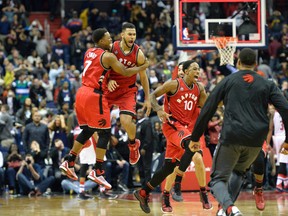 Raptors guard Cory Joseph celebrates with teammates after hitting the game winning shot as time expires against the Washington Wizards at Verizon Center. The Raptors defeated then Wizards 84-82.(USA TODAY)