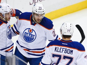 Edmonton Oilers' Leon Draisaitl (29) celebrates his goal with teammates Taylor Hall (4) and Oscar Klefbom (77) during the first period of an NHL hockey game against the Pittsburgh Penguins in Pittsburgh, Saturday, Nov. 28, 2015. (AP Photo/Gene J. Puskar)