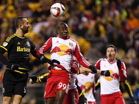 New York Red Bulls forward Bradley Wright-Phillips (99) and Columbus Crew SC forward Justin Meram (9) leap to head the ball in the first half of leg one of the Eastern Conference championship at Mapfre Stadium. The second leg between the teams takes place Sunday at Red Bull Arena. (Geoff Burke/USA TODAY Sports)