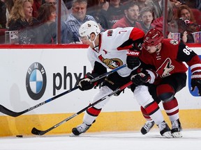 Kyle Turris #7 of the Ottawa Senators attempts a control the puck under pressure from Mikkel Boedker #89 of the Arizona Coyotes during the first period of the NHL game at Gila River Arena on November 28, 2015 in Glendale, Arizona.  Christian Petersen/Getty Images/AFP