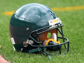 The Edmonton Eskimos' green helmets pre-logo before a team practice in 2012. Some are demanding a name change for the team, arguing its current name is offensive to aboriginal people. (File)