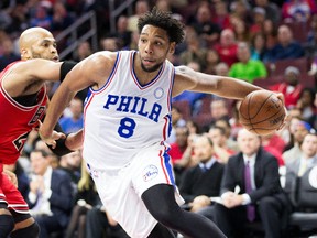 Philadelphia 76ers centre Jahlil Okafor (8) drives past Chicago Bulls forward Taj Gibson at Wells Fargo Center. (Bill Streicher/USA TODAY Sports)