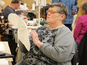 Christine Huctwith makes shoe covers at Wawanosh Enterprises in Sarnia in this 2015 file photo. It and other sheltered workshops across Ontario are going to be closed forever, according to a Toronto Star article quoting Ontario's Ministry of Community and Social Services. (File photo)