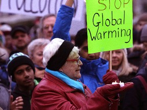 More than 1,000 people turned out to a clean energy rally at Queen's Park on Sunday. (CRAIG ROBERTSON, Toronto Sun)