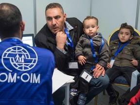 A family of Syrian refugees are being interviewed by authorities in hope of being approved for passage to Canada at a refugee processing centre in Amman, Jordan November 29, 2015. REUTERS/Paul Chiasson/Pool