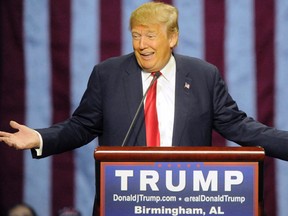 Republican presidential candidate Donald Trump speaks to supporters at a campaign rally Saturday, Nov. 28, 2015 at Robarts Arena in Sarasota, Fla.  Trump bragged about his high standing in the polls, slammed super PACS as "a scam" and dismissed nomination rivals Marco Rubio and Jeb Bush in a campaign stop Saturday in their home state of Florida.  (AP Photo/Steve Nesius)