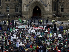 Protesters take part in a rally held a day before the start of the 2015 Paris Climate Change Conference (COP21), on Parliament Hill on Nov. 29, 2015. REUTERS/Chris Wattie