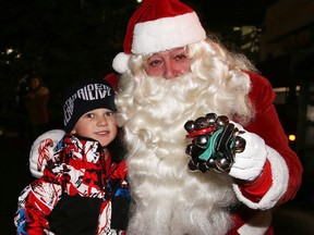 Ethan Querney meets Santa who was on hand for the Sudbury Charities Foundation Festival of Lights launch at Science North in Sudbury, Ont. on Thursday November 26, 2015. The festival runs until Jan. 8. Gino Donato/Sudbury Star/Postmedia Network