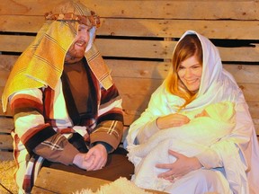Jesse and Lisa Britton hold eight-week-old son Milo, portraying the baby Jesus, in the two-night performance of Bethlehem Live held at the Upper Thames Missionary Church this past weekend. ANDY BADER/MITCHELL ADVOCATE