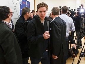 Edmonton Oilers forward Connor McDavid leaves a press conference outside of an Oilers practice at Clareview Recreation Centre in Edmonton, Alta., on Monday November 16, 2015. McDavid  was hurt during a game against the Philadelphia Flyers on Nov. 3. He didn't skate today. Ian Kucerak/Edmonton Sun/Postmedia Network