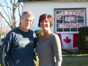 Brian Melady and Vicki Powers stand in front of the home in Seaforth that will be donated rent-free until the Ethiopian refugee family are settled and can take care of themselves . (Shaun Gregory/Huron Expositor)