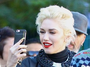 Gwen Stefani takes her three sons to Disneyland Park in Anaheim, California. (WENN.COM)