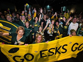 Fans cheer on the Edmonton Eskimos during a Grey Cup party at the Edmonton Expo Centre on Sunday. (Codie McLachlan/Edmonton Sun/Postmedia Network)