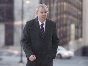 Dennis Oland heads to the Law Courts as his murder trial continues in Saint John, N.B., on October 21, 2015. THE CANADIAN PRESS/Andrew Vaughan