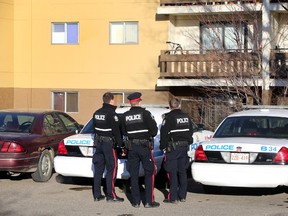 Police investigate a homicide at an apartment on 13408 49 Street in Edmonton, Alberta on November 22, 2015. A woman was slain the night earlier. (Perry Mah/Edmonton Sun File)