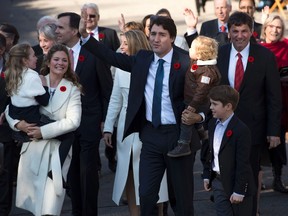 Prime Minister Justin Trudeau, his wife Sophie Gregoire-Trudeau and children Xavier, right, Hadrien, Ella-Grace walk past crowds to Rideau Hall in Ottawa, in this Nov.4, 2015 file photo. (THE CANADIAN PRESS/Adrian Wyld)